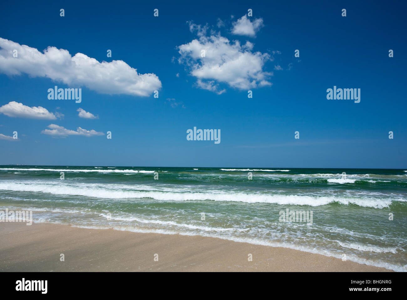 Beautiful seascape with blue sky and fluffy clouds Stock Photo - Alamy