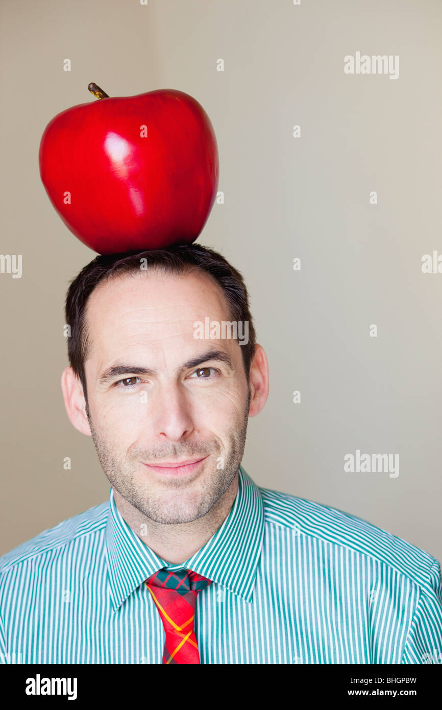 man with oversized apple on his head Stock Photo Alamy
