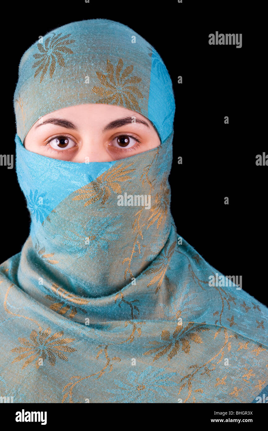 Young muslim woman isolated on black background Stock Photo