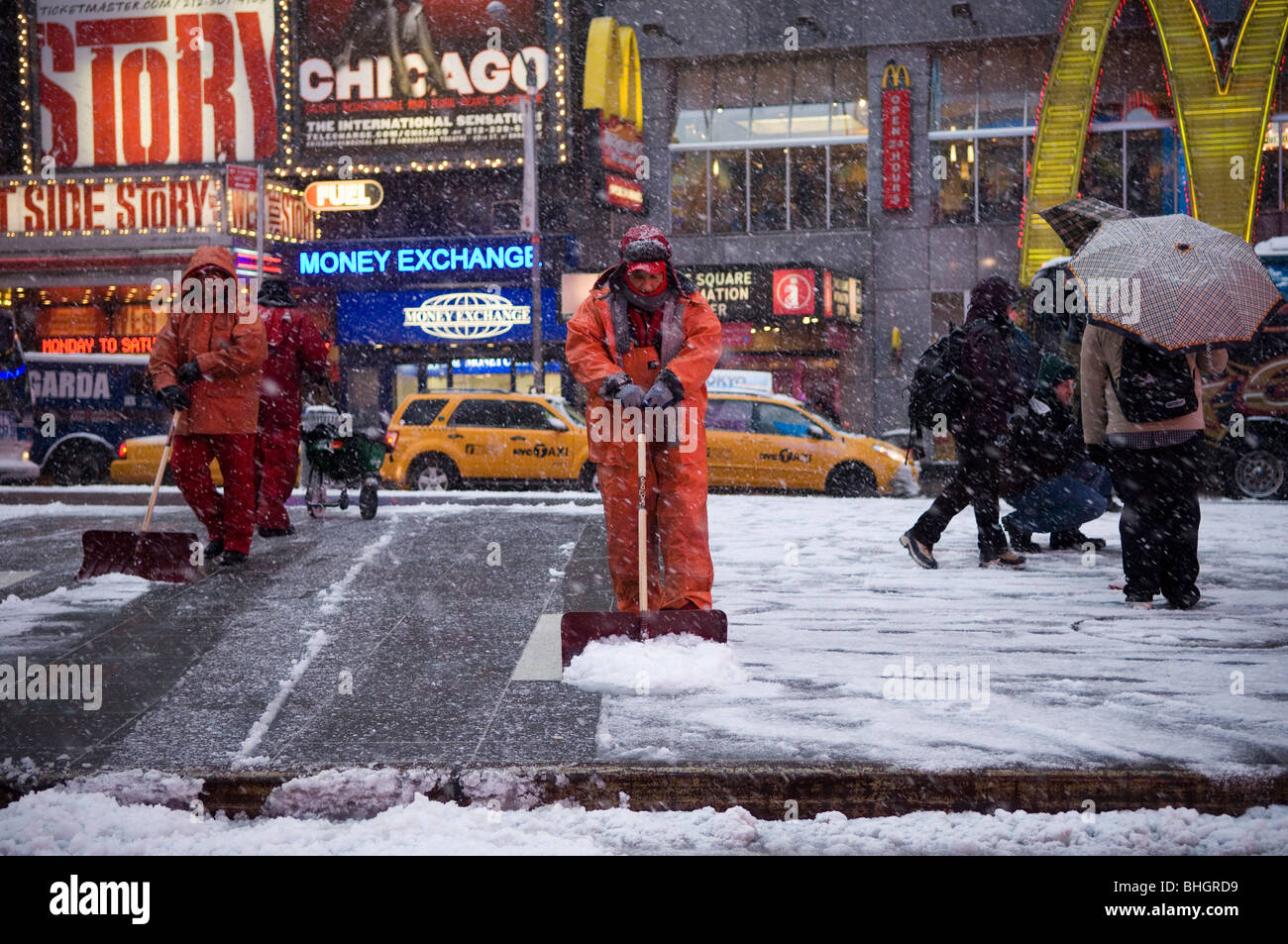 Workers shovel snow in Times Square during a storm that is covering the East Coast Stock Photo