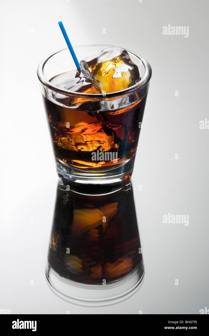Black Russian mixed drink on a grey background with reflection Stock