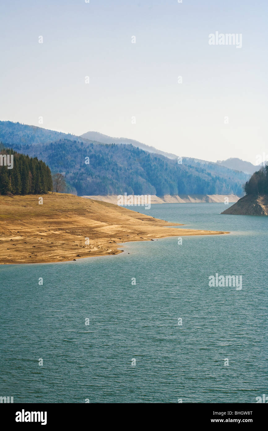 Lake between mountains in a sunny day Stock Photo - Alamy