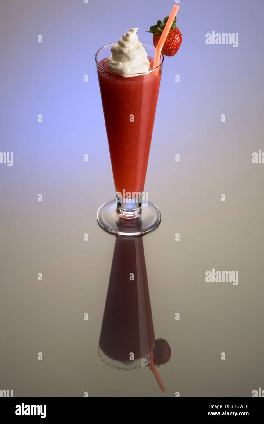 Frozen strawberry Daiquiri mixed drink with whipped cream and fruit