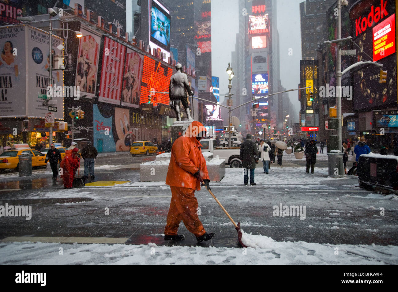 Workers shovel snow in Times Square during a storm that is covering the East Coast Stock Photo