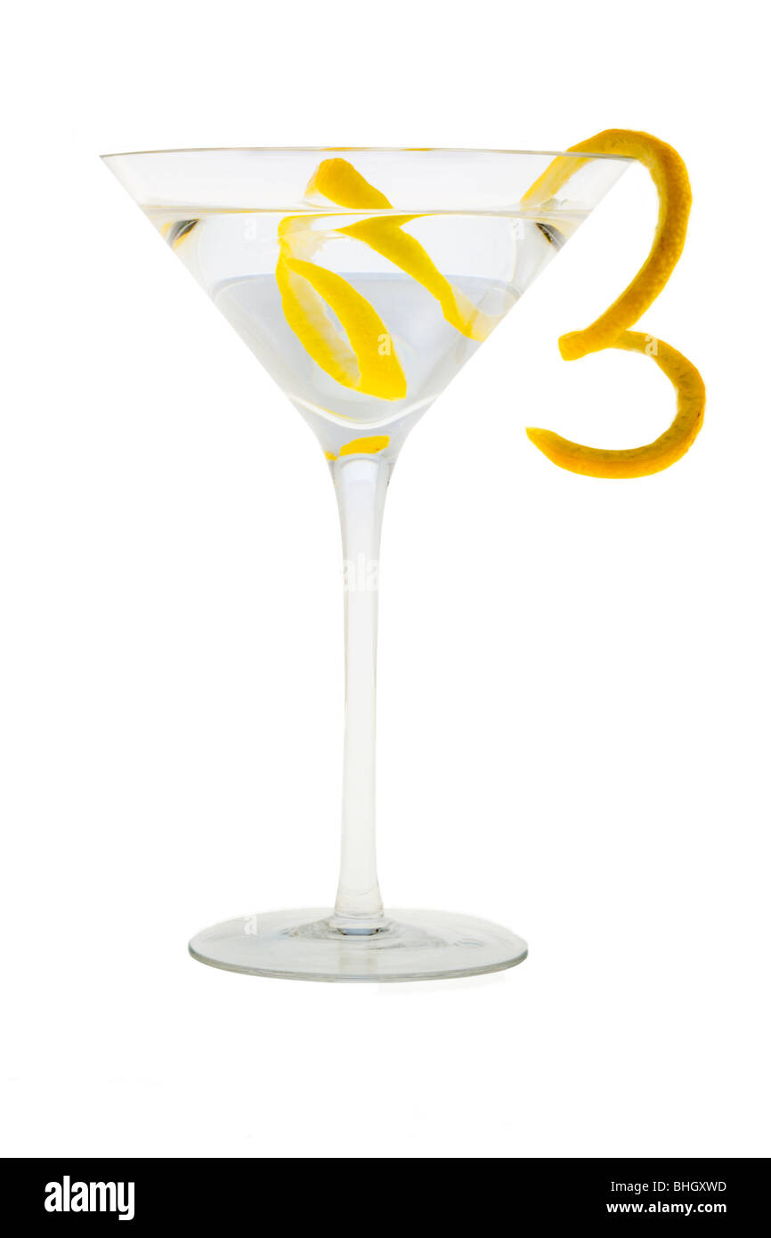Martini mixed drink with lemon peel garnish on a white background Stock