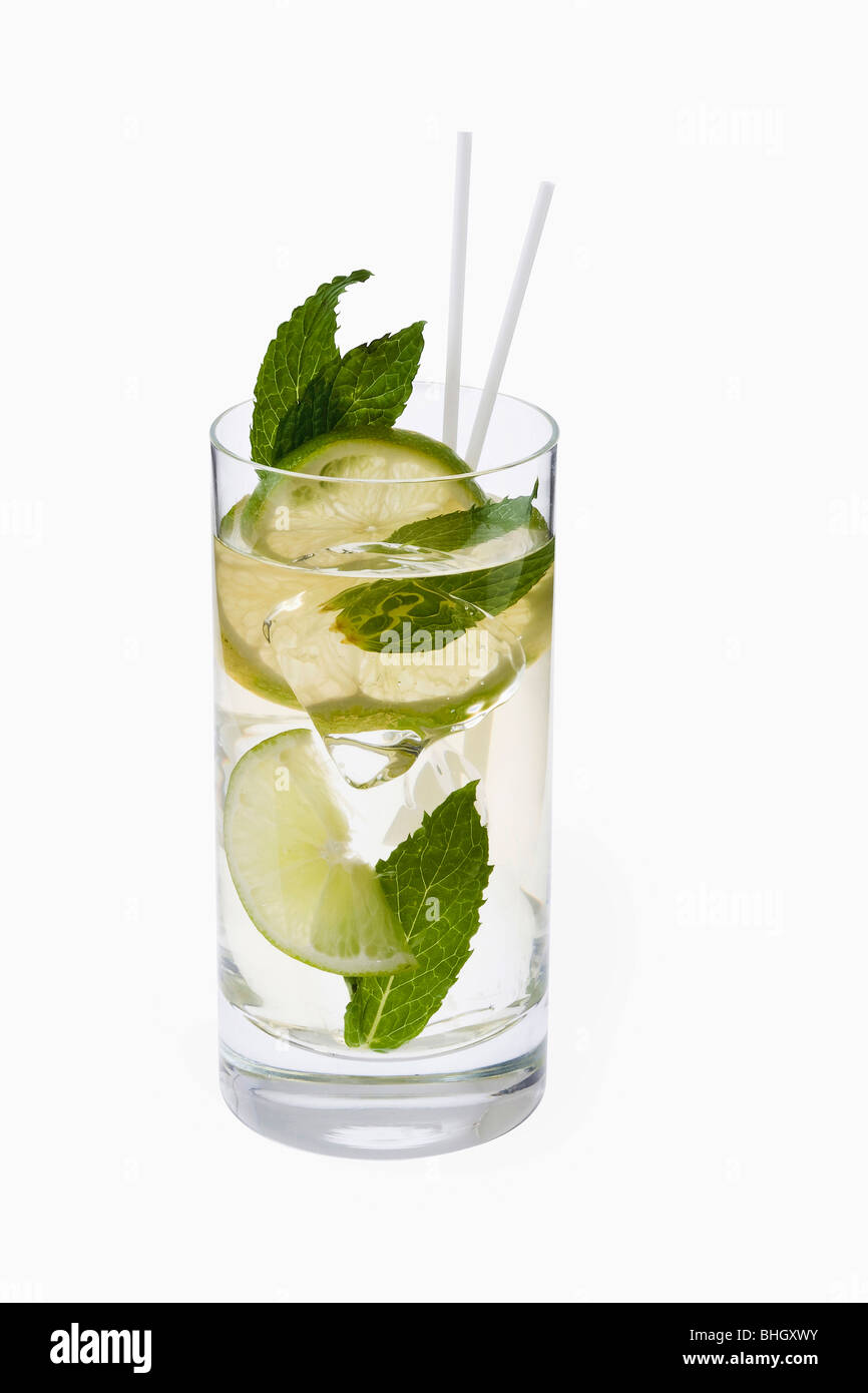 Mojito mixed drink with mint garnish on a white background Stock Photo