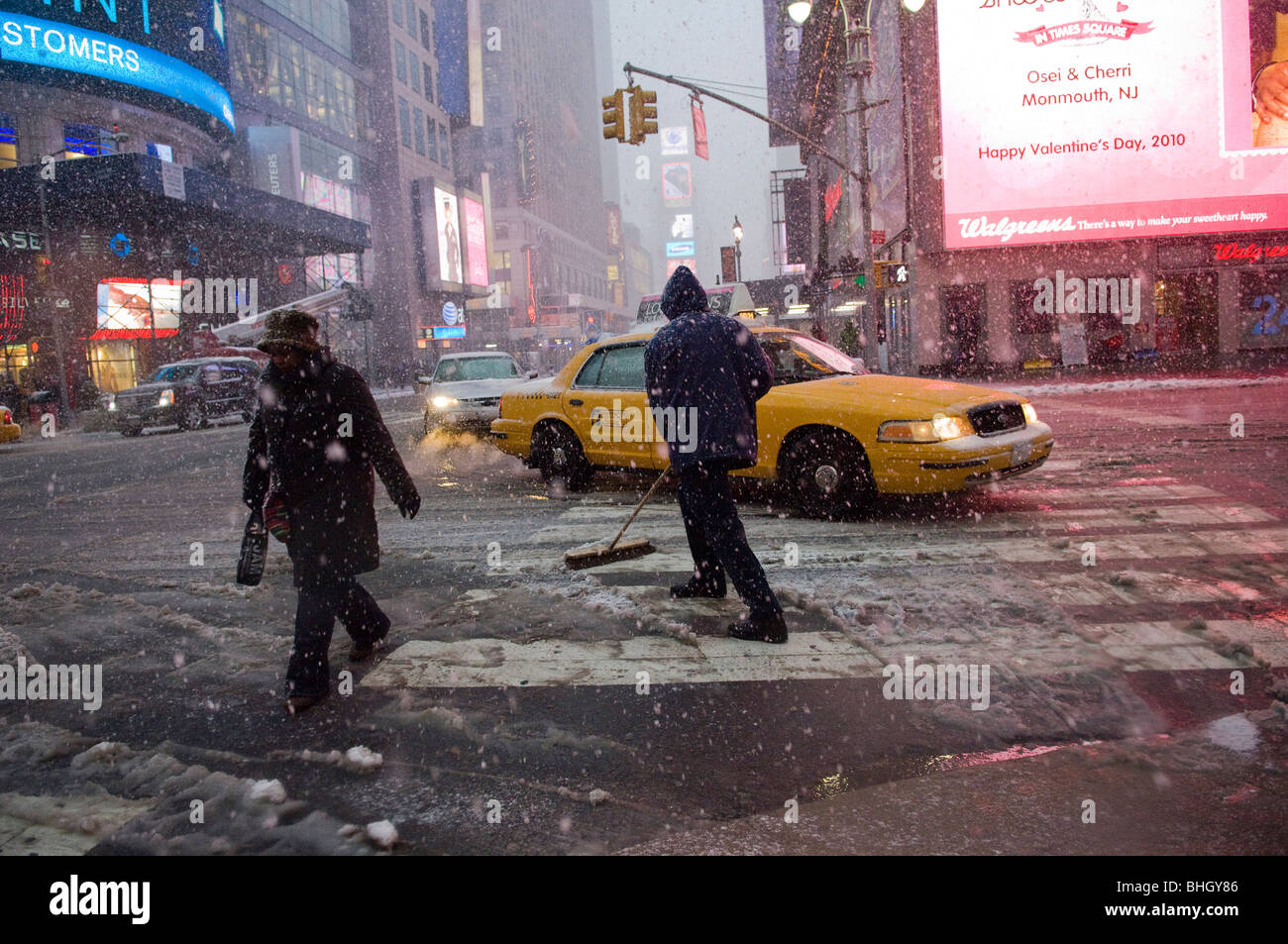 Workers shovel snow in Times Square during a storm that is covering the East Coast Stock Photo