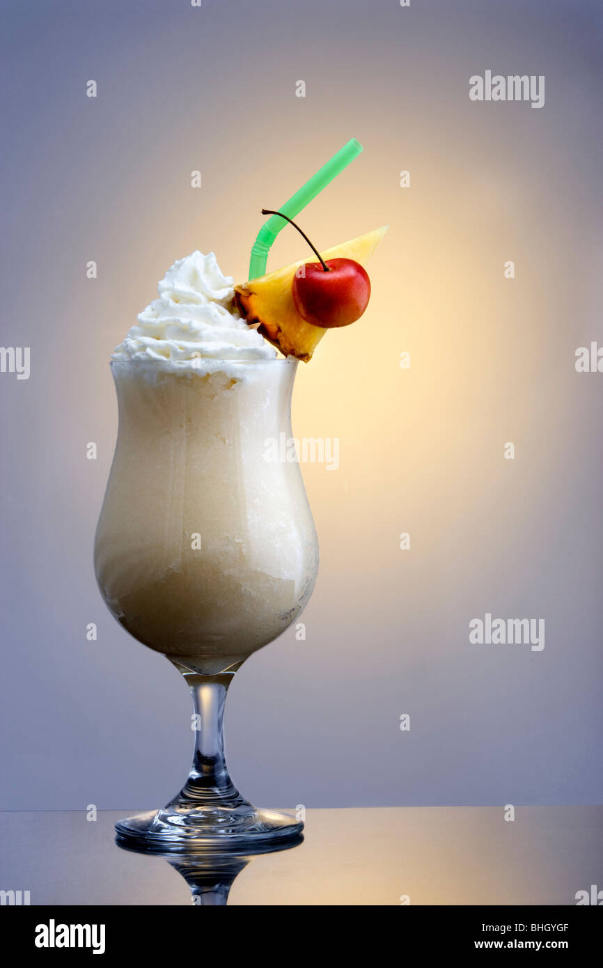 Pina Colada mixed drink on plain background with reflection Stock Photo