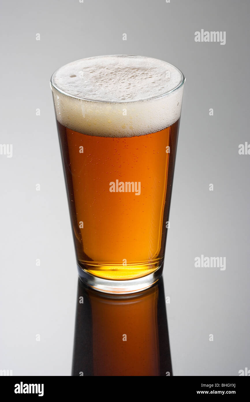 Glass of beer on a gray backgeround Stock Photo