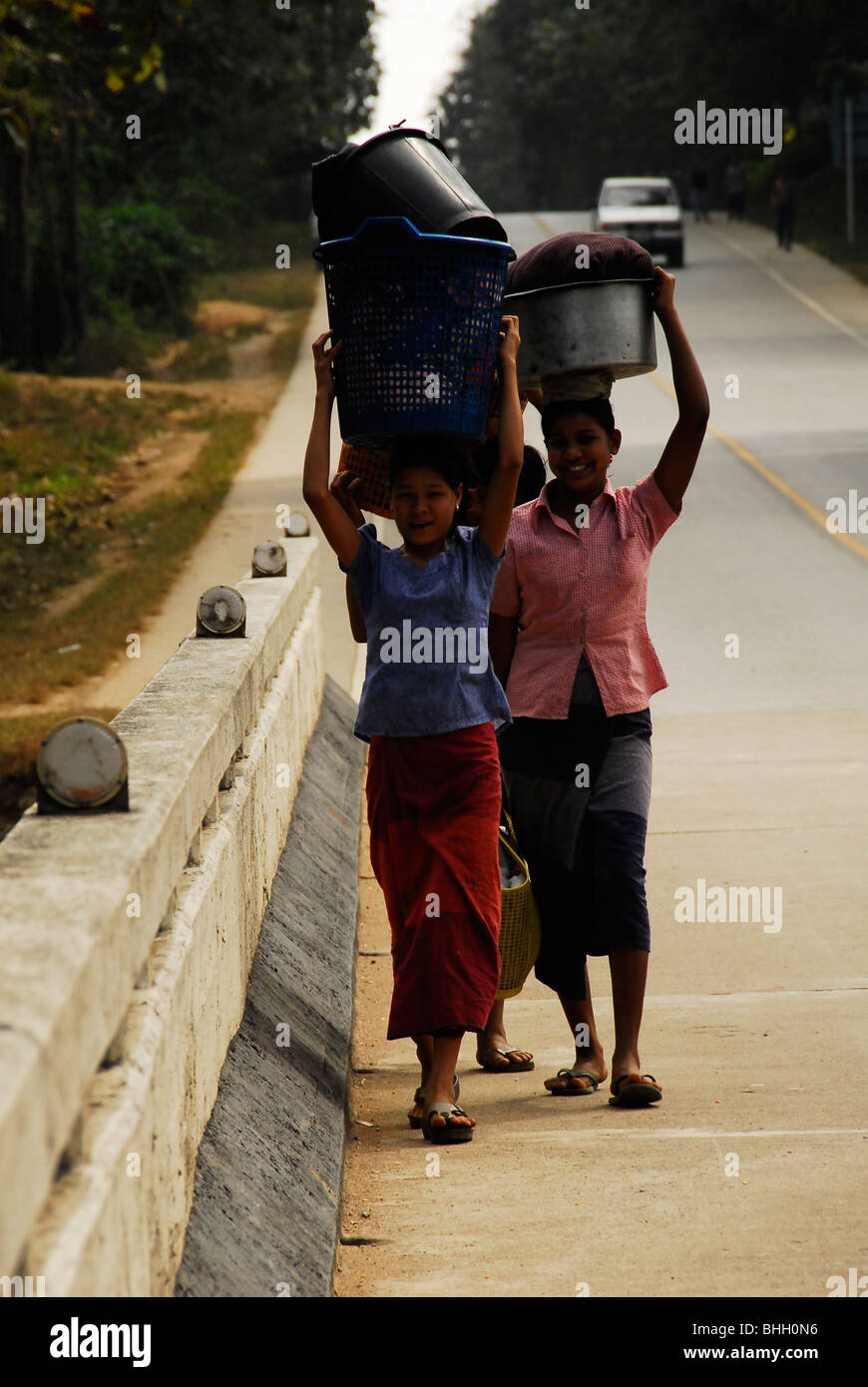 karen refugee's going to stream to wash clothes, mae la refugee camp , near mae sot , north thailand Stock Photo