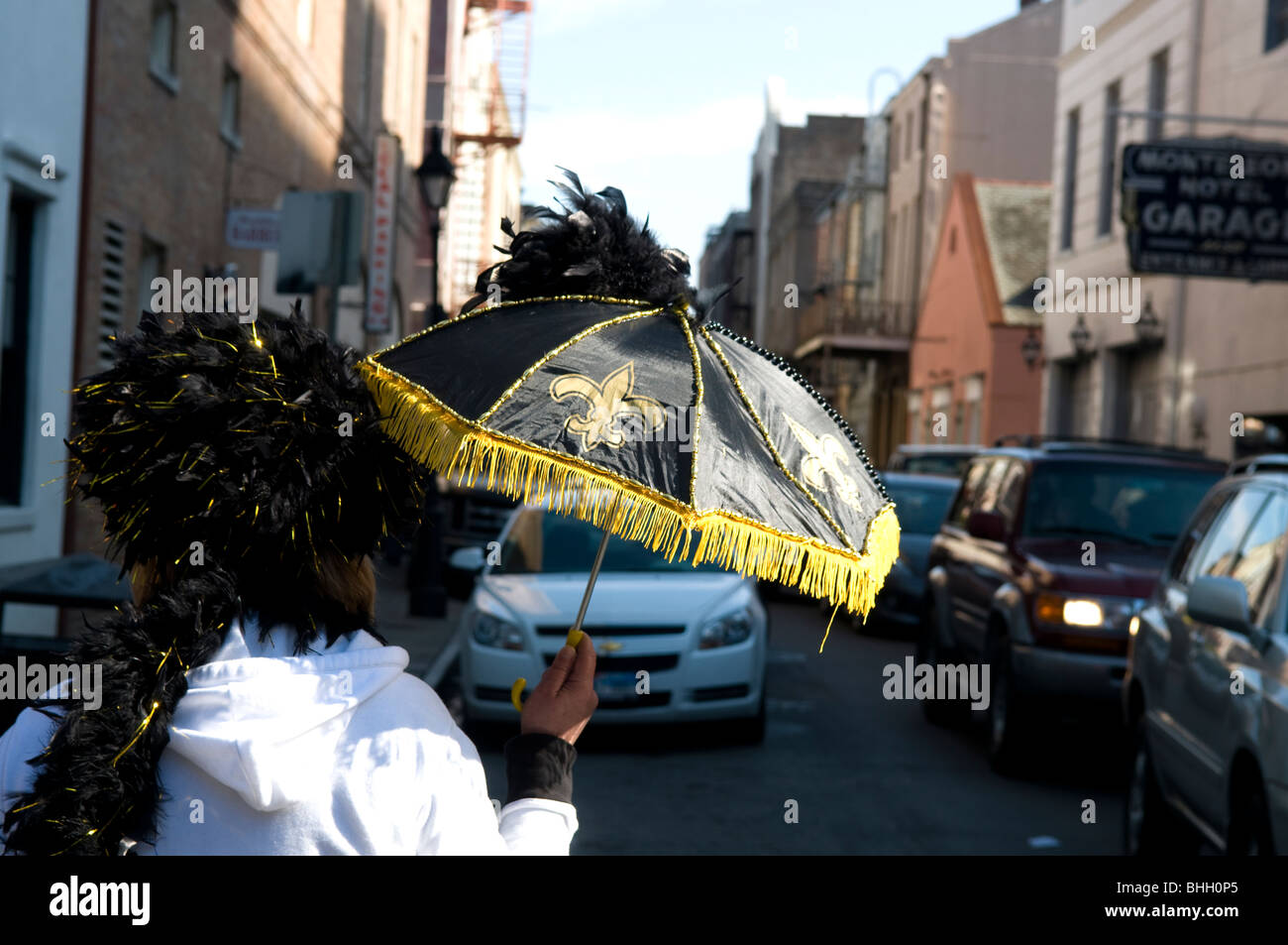 Woman carrying Saints umbrella, New Orleans, Louisiana, Saints Super Bowl XLIV Weekend Stock Photo