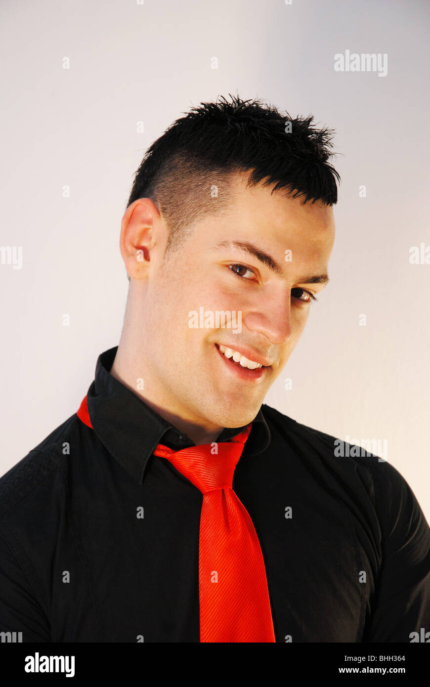 Young man smiling and looking at the camera. Close view. Stock Photo