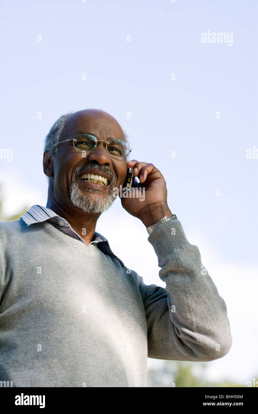 Senior man using a mobile phone, Sweden. Stock Photo