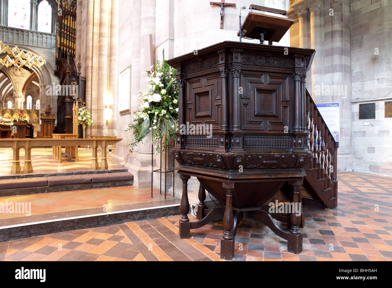 The pulpit in Hereford Cathedral,fine carving and balustrades adorn this fine piece of furniture. Stock Photo