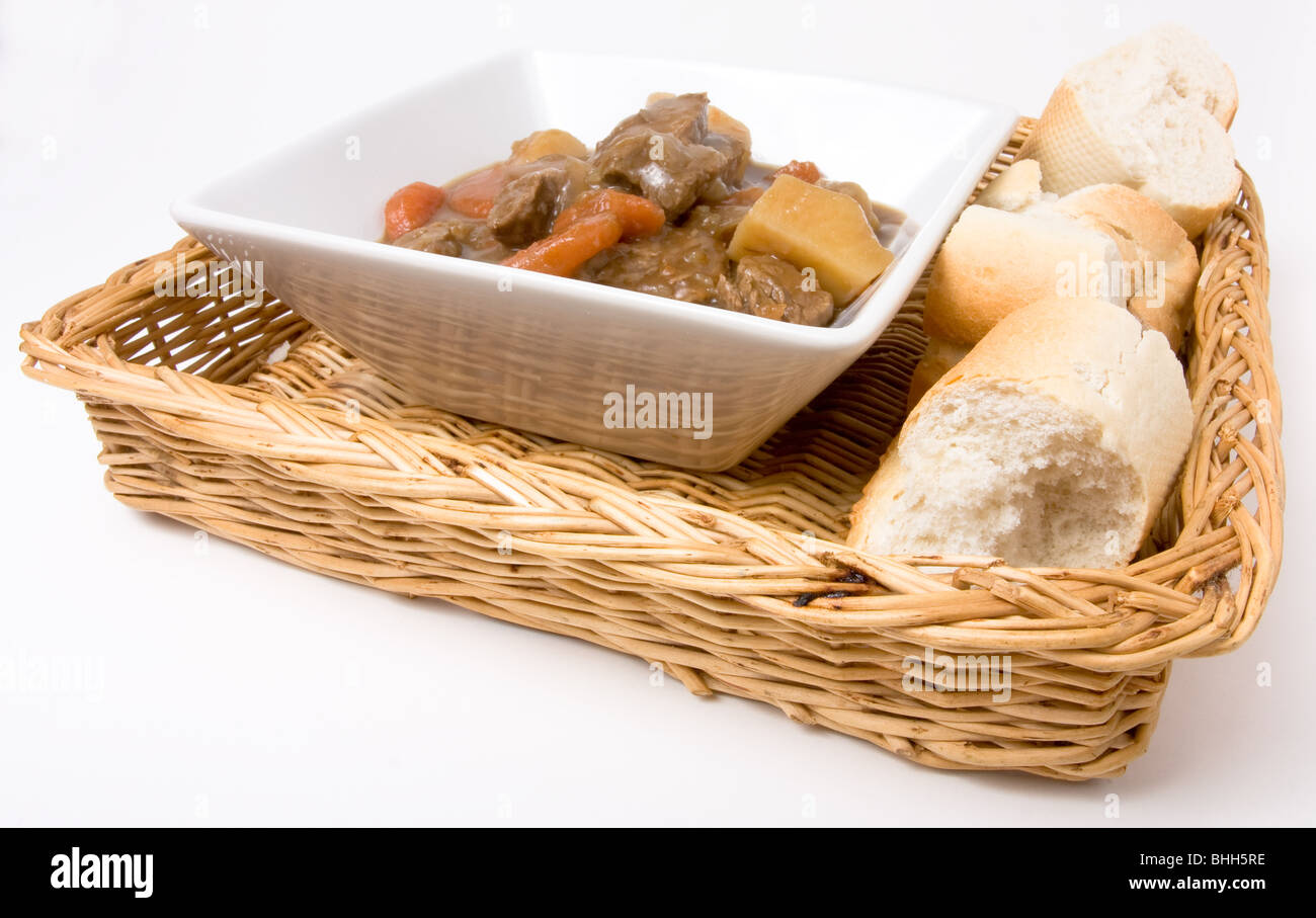 Beef stew or Goulash with crusty white bread. Stock Photo