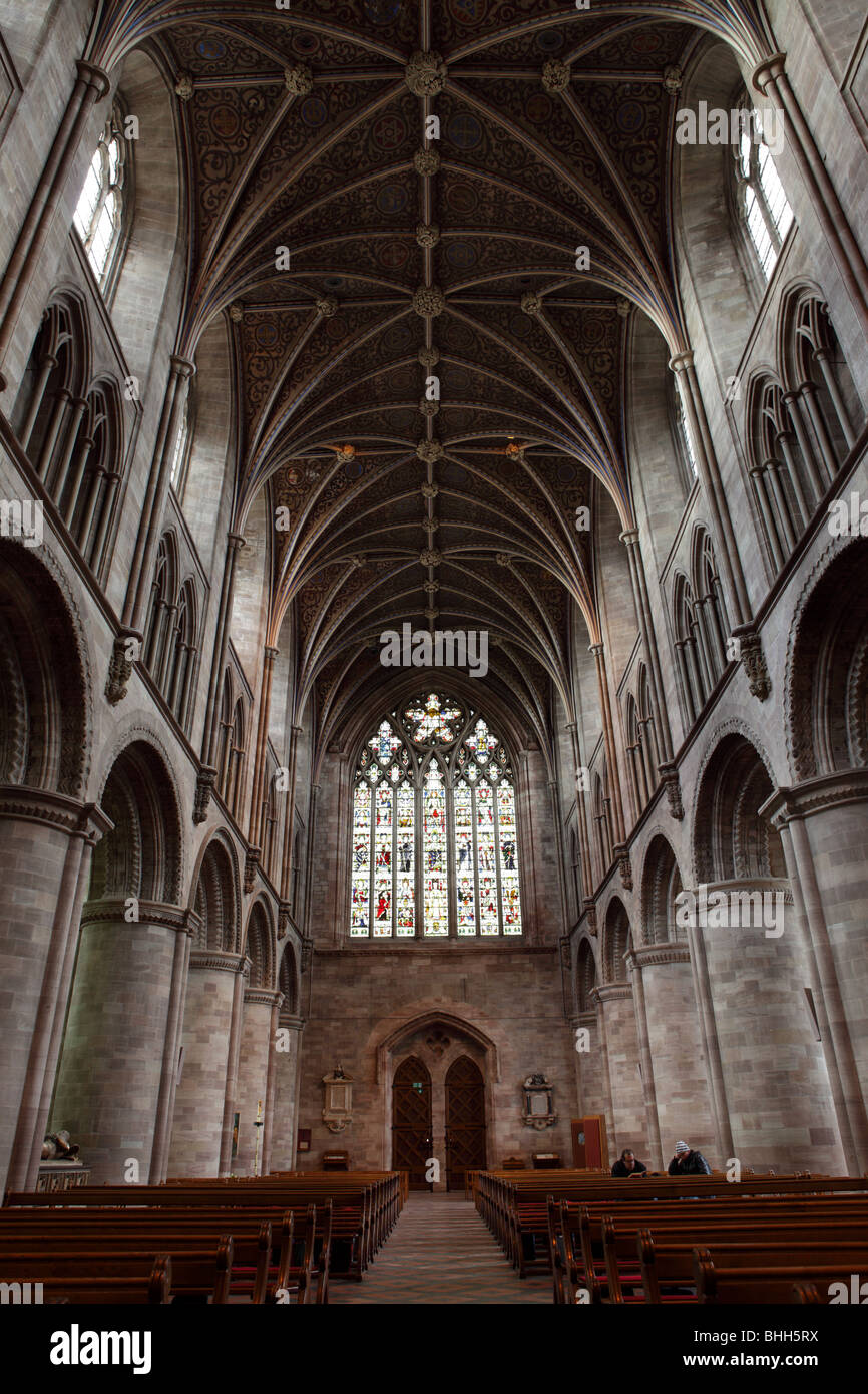 The vaulted ceiling/roof at Hereford Cathedral looks down on the Nave,the West Door and Window also attendance. Stock Photo