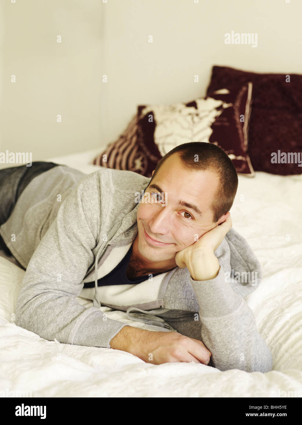 Portrait of a mid-adult man in a bed, Sweden. Stock Photo