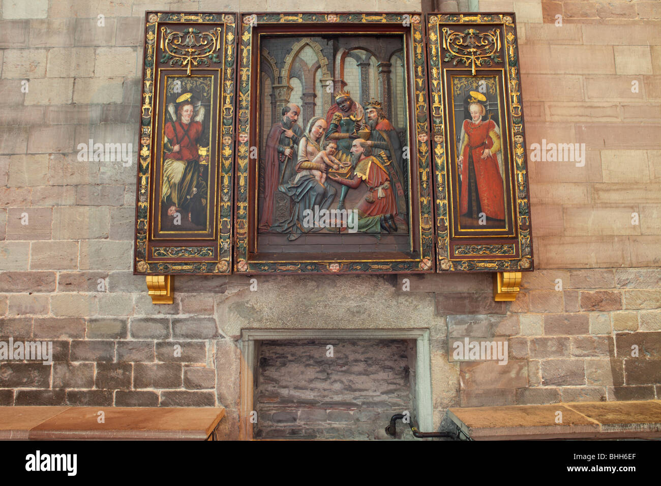 Deep rich colors in this shallow relief of an religious scene,Mary and the infant Jesus,Hereford Cathedral,England. Stock Photo