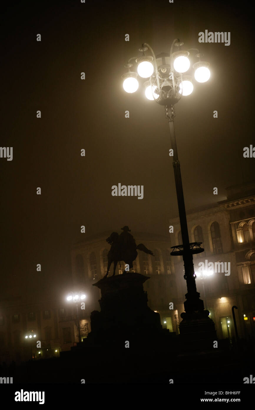 Statue by a streetlamp, Italy. Stock Photo