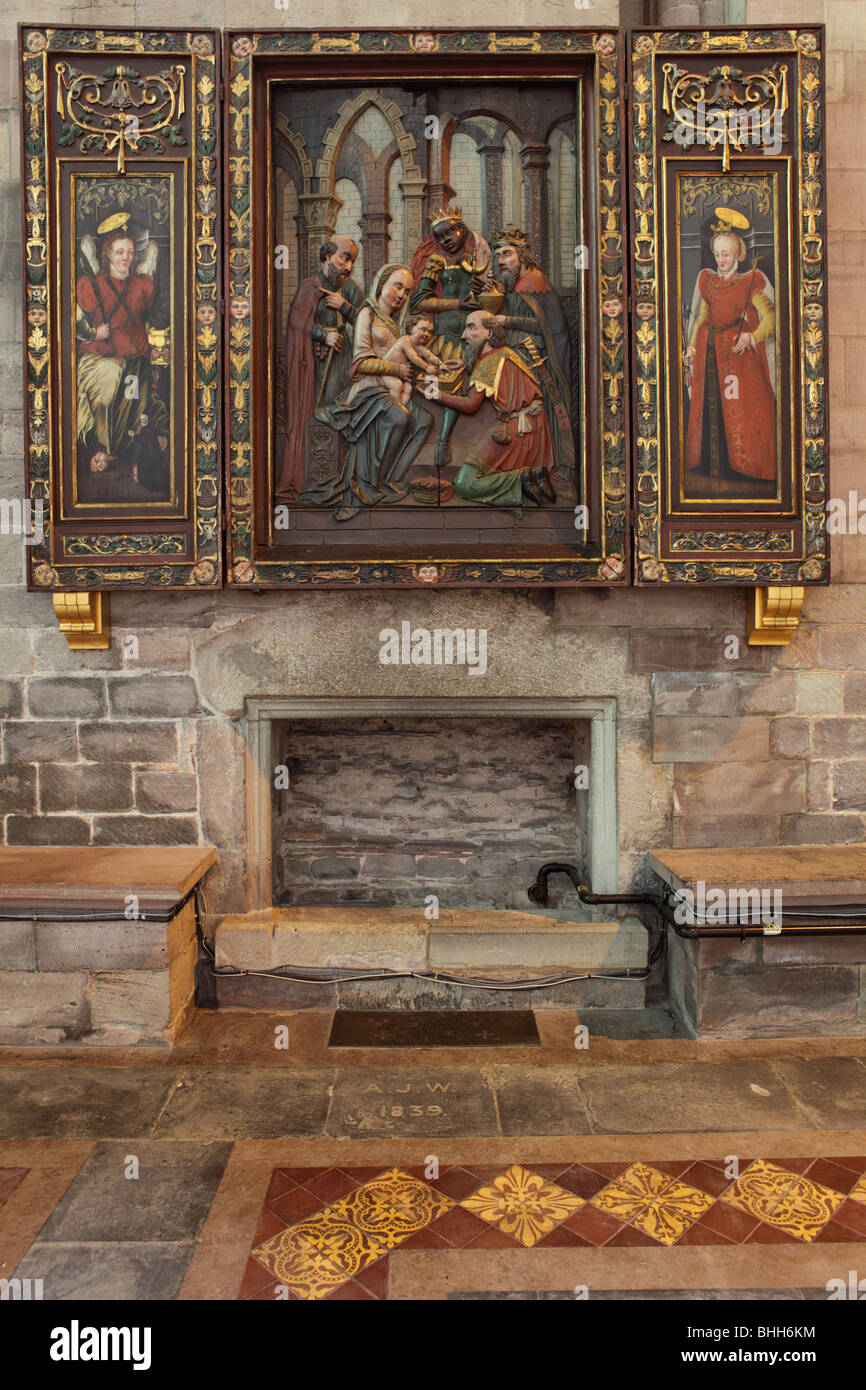 Slight  relief of  Mary and the infant Jesus with  what appears to be the Three Kings situated in the south Transept. Stock Photo