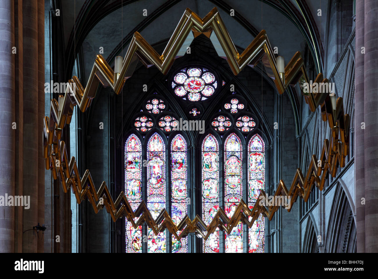 The Hereford Corona in Hereford Cathedral with the north transept window by Hardman in the background. Stock Photo