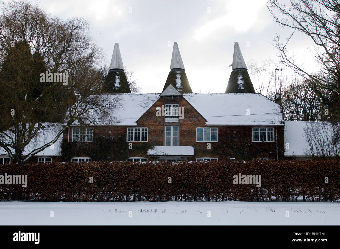 Oast house in snow chartham downs kent england uk Stock Photo