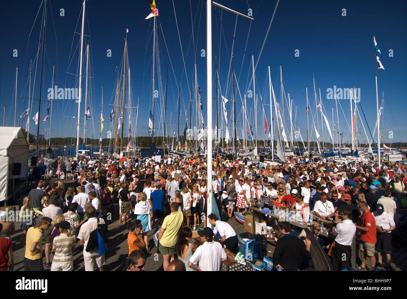 Crowd of people before the beginning of a sailing competition, Sandhamn, Stockholm archipelago, Sweden. Stock Photo
