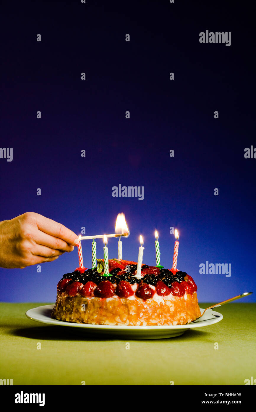 Candles on a birthday cake Stock Photo Alamy