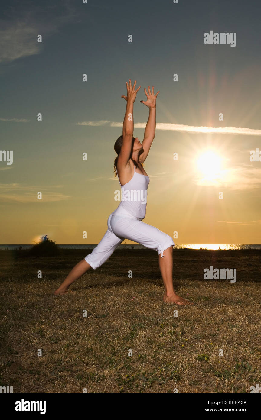 A woman doing yoga, Gotland, Sweden Stock Photo Alamy