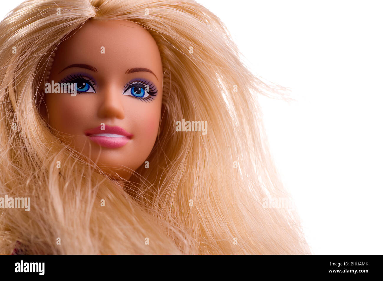 Close-up of a Barbie doll face with blonde hair & blue eyes Stock Photo