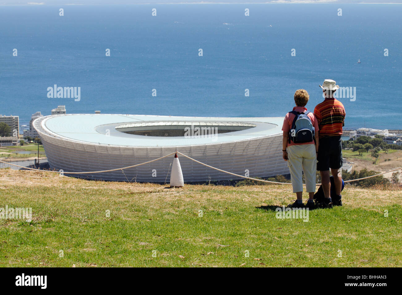 Tourists overlook the Green Point Stadium in Cape Town built for the