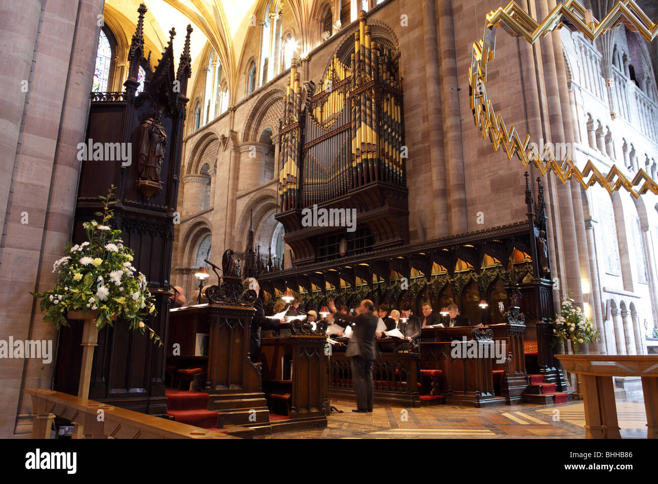 The case designed by Scott and the instrument designed by Henry Willis, the organ dominates the Choir at Hereford Cathedral. Stock Photo