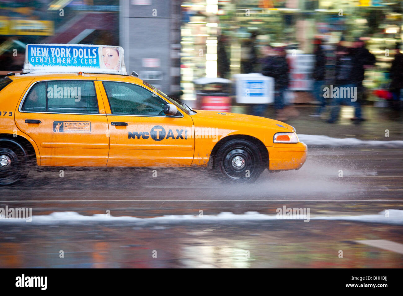 Yellow Taxi in the winter in Times Square, New York City Stock Photo