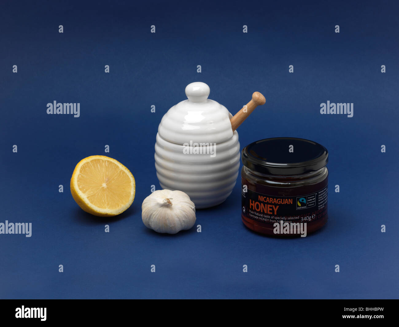Cold Cure Lemon Garlic and Pot of Honey Stock Photo Alamy