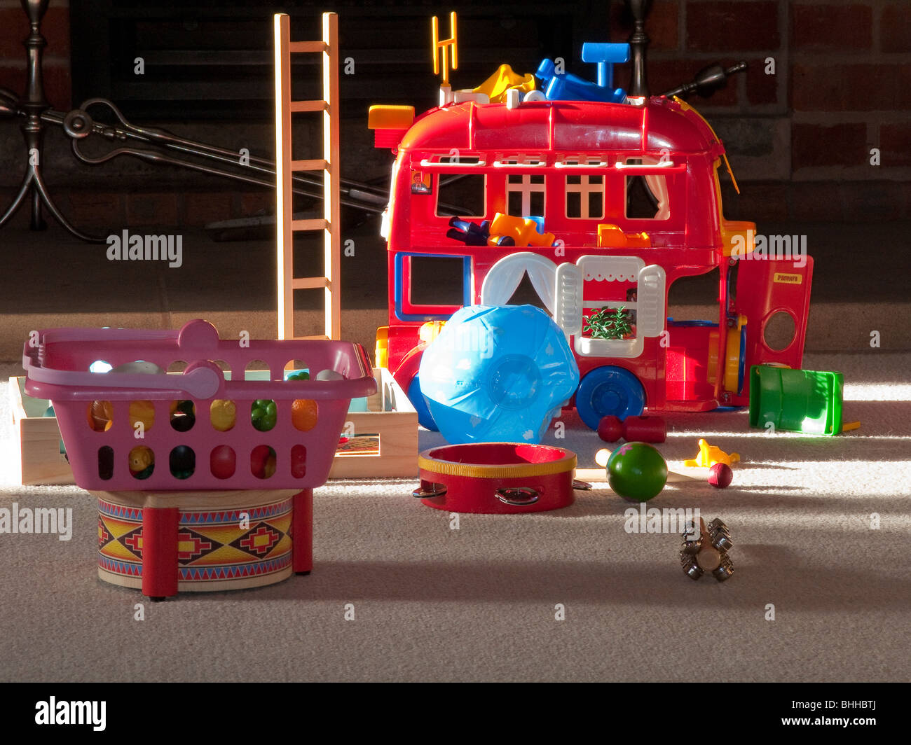 Toys on floor in house Stock Photo - Alamy