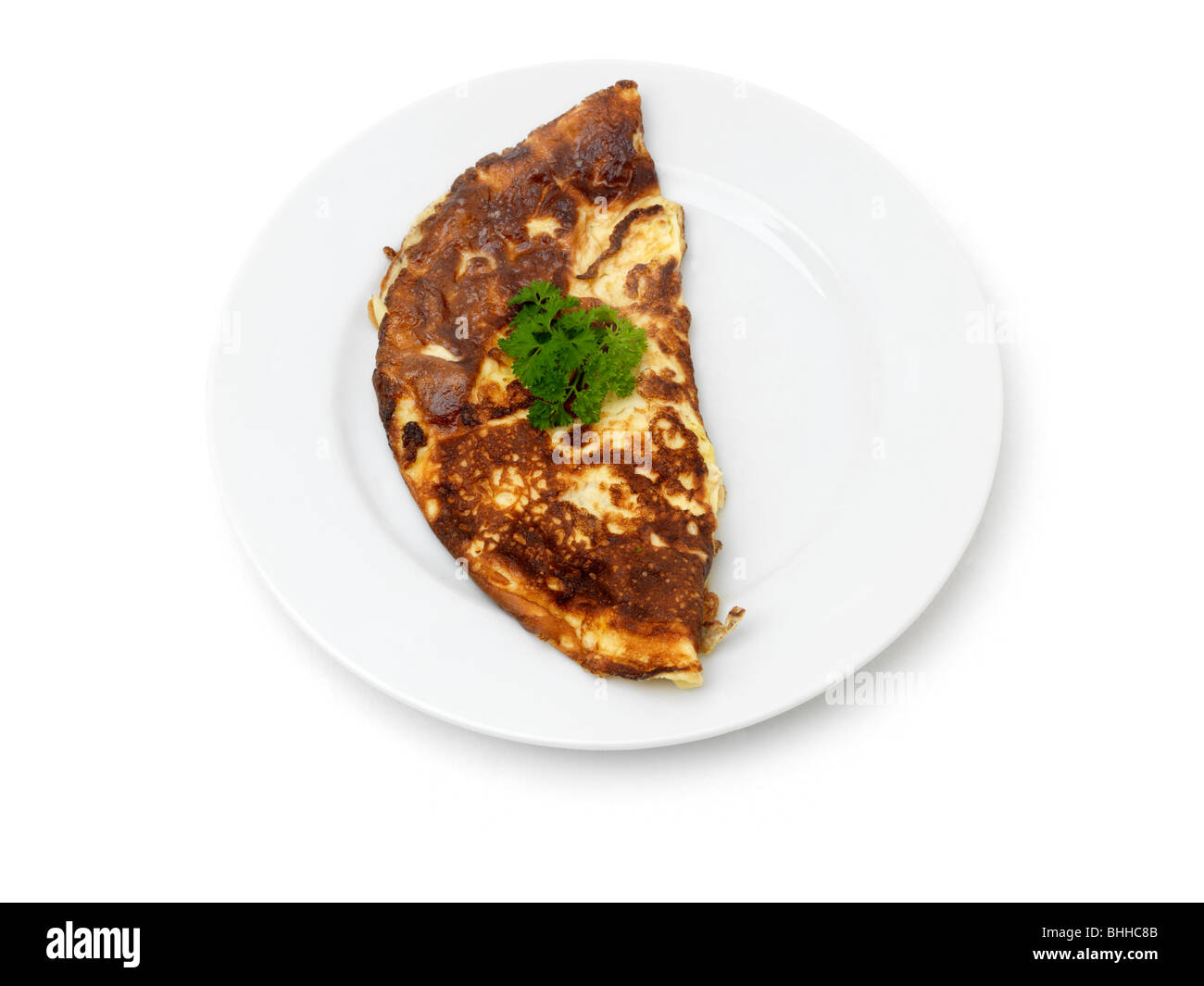 A Plate with Omelette and a bit of Garnish Stock Photo