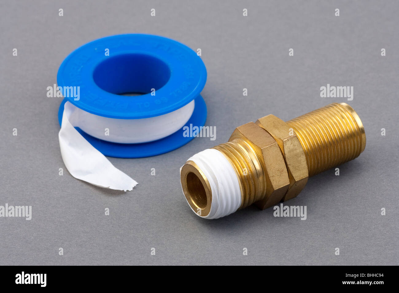 PTFE teflon tape used to seal threaded pipe connectors Stock Photo