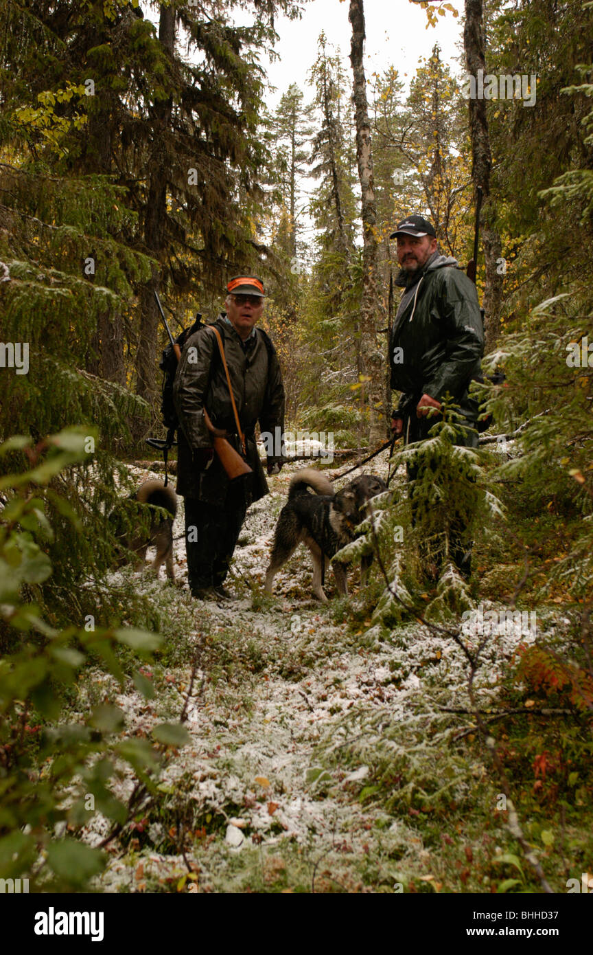 Men elk-hunting, Sweden. Stock Photo