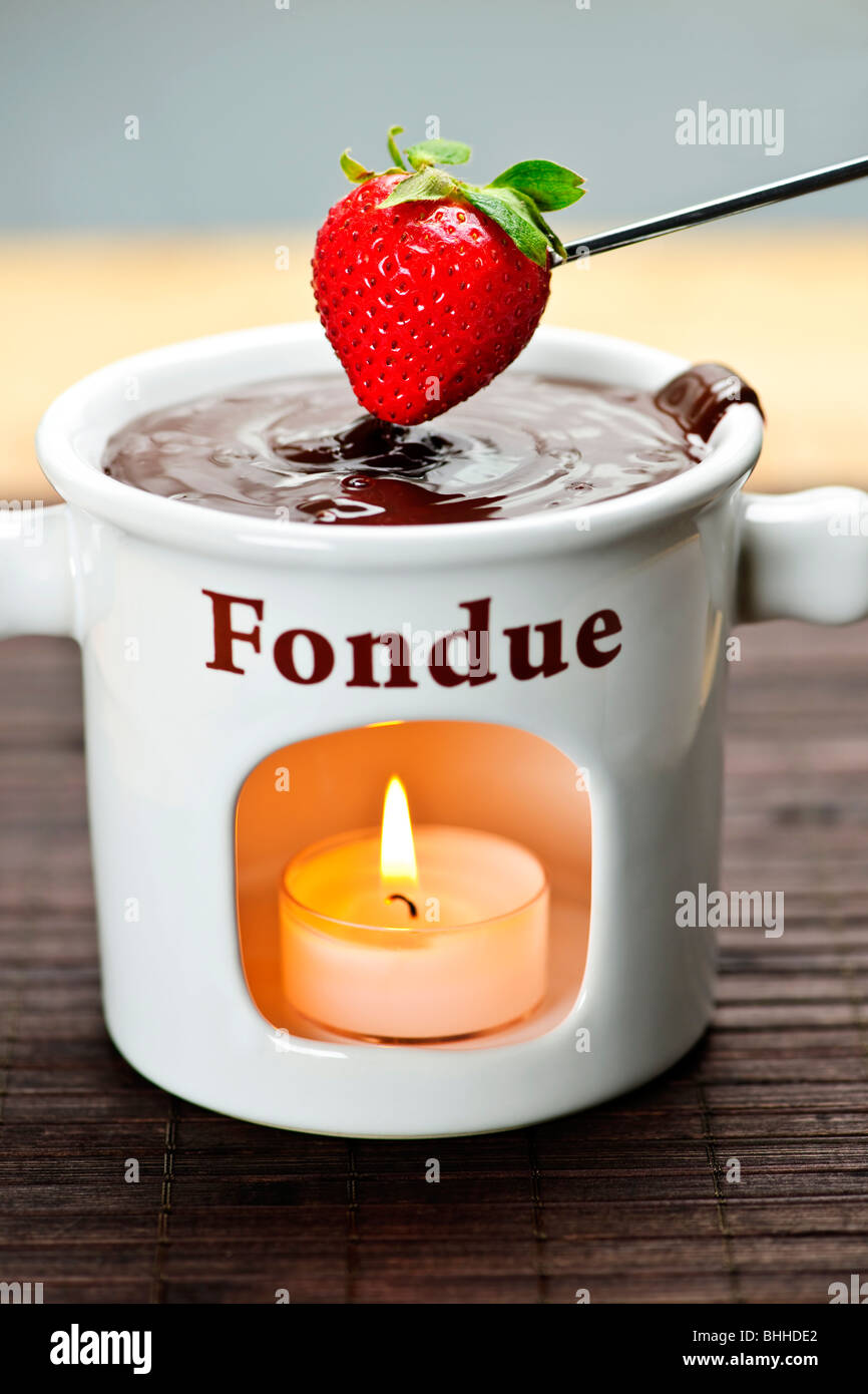 Strawberry dipped in delicious melted chocolate fondue Stock Photo