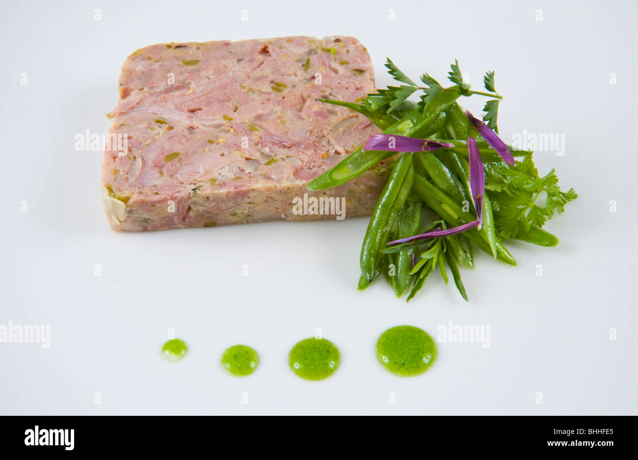 Ham Hock Terrine on white plate at The Felin Fach Griffin restaurant, near Brecon, Powys, Wales, UK Stock Photo