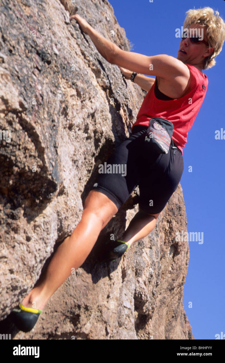 Woman rock climbing Stock Photo - Alamy