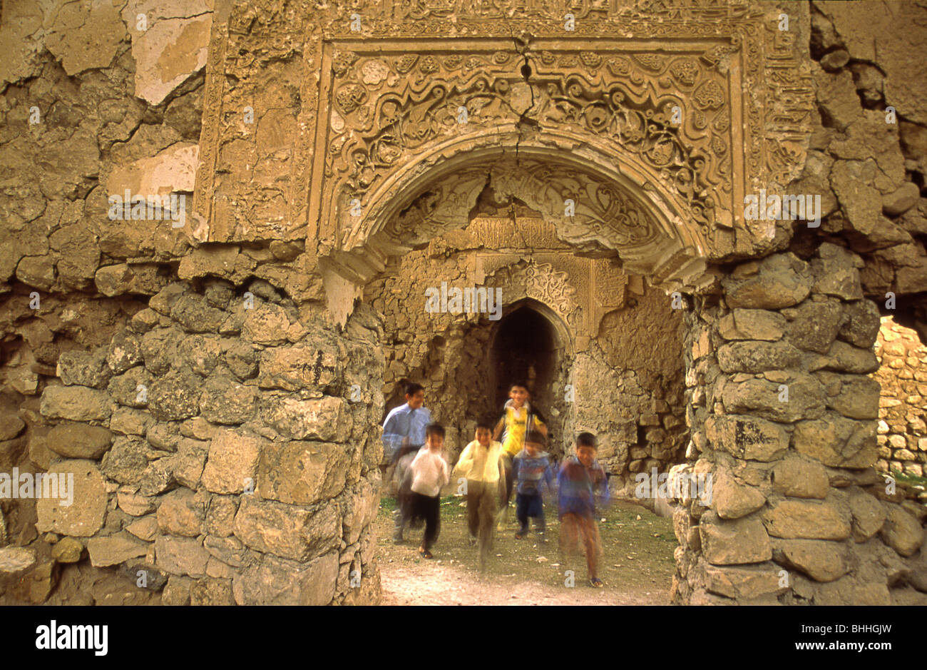 Children playing around ancient ruins of Hasankeyf, Turkey Stock Photo