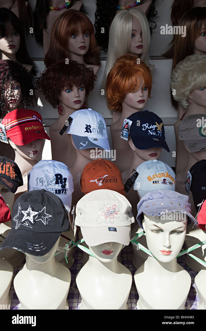 Caps and wigs on sale in shop El Paso Texas USA Stock Photo