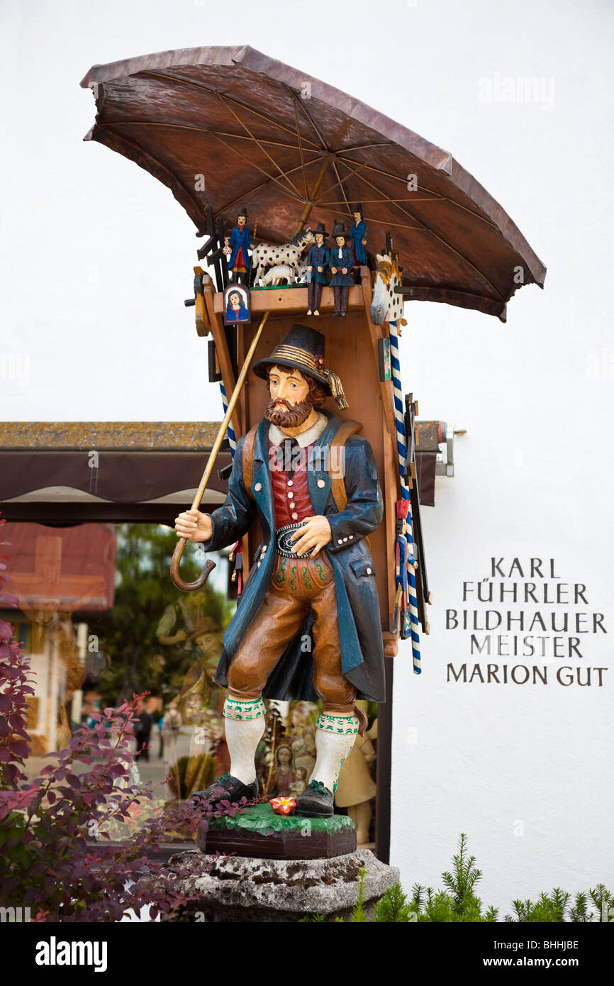 Bavarian carved wooden figure outside a shop in the town of Oberammergau, Bavarian Alps, Germany, Europe Stock Photo