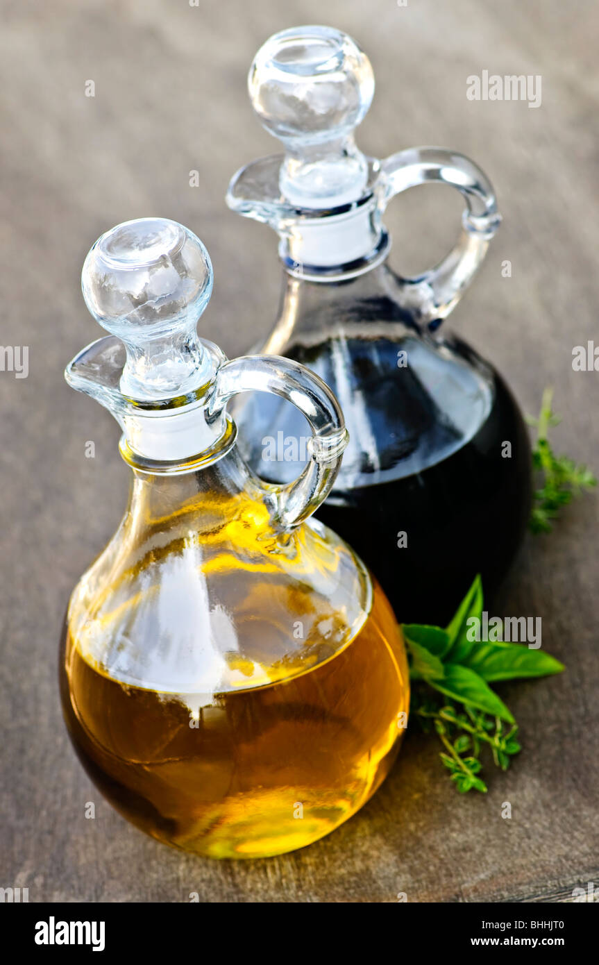 Oil and balsamic vinegar glass bottles with spouts Stock Photo