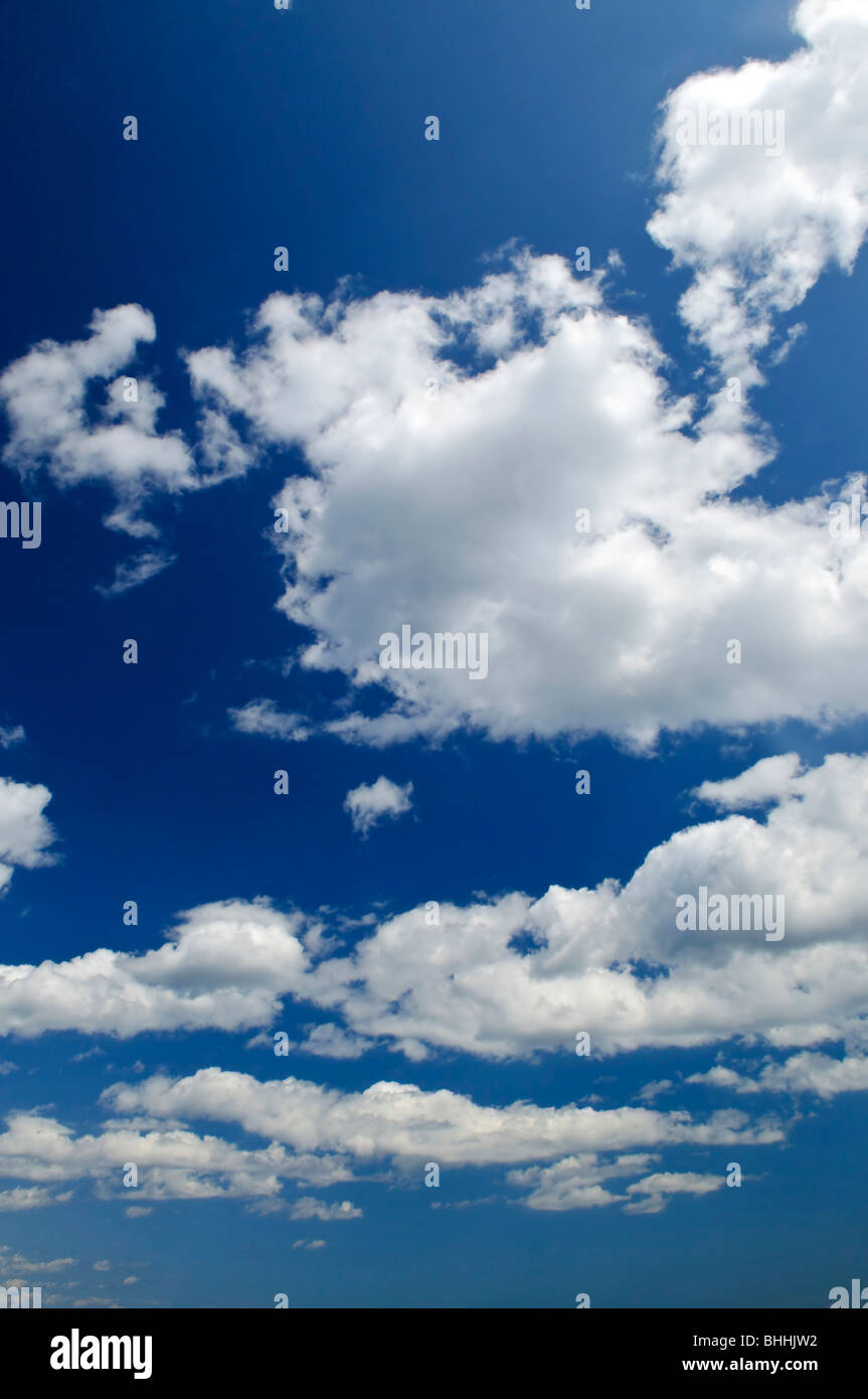 Background of blue sky with white cumulus clouds Stock Photo - Alamy