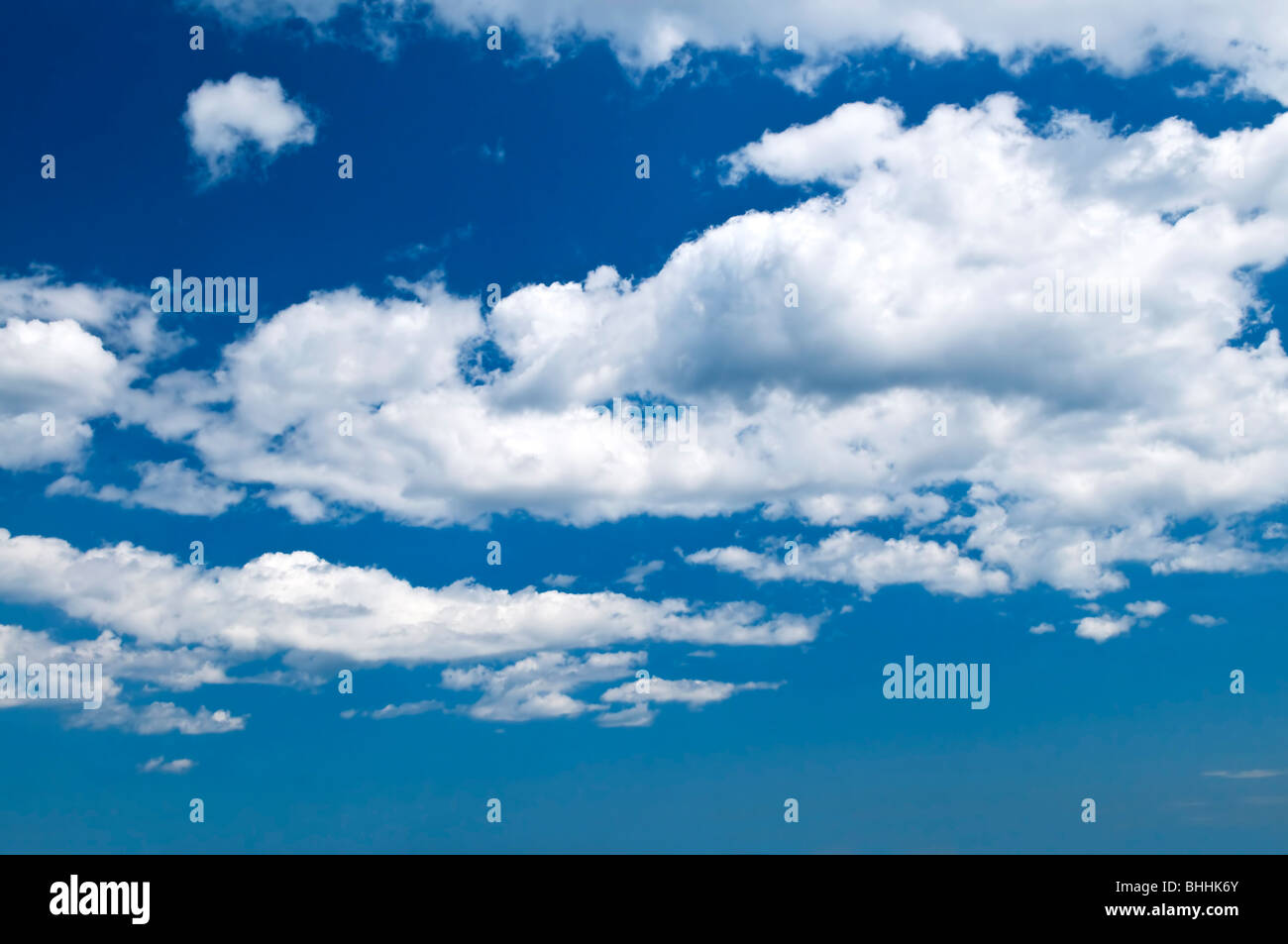 Background of blue sky with white cumulus clouds Stock Photo - Alamy