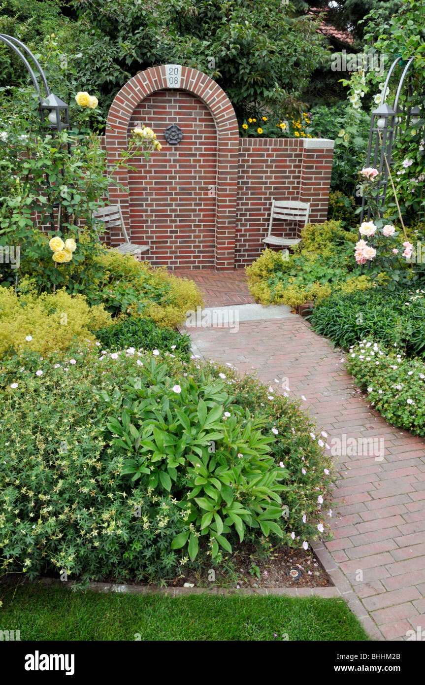 Seating area in a rose garden Stock Photo
