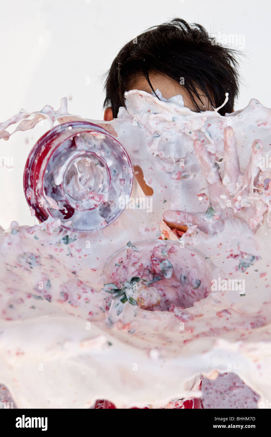 boy getting hysterically splashed by overflowing blender disaster Stock