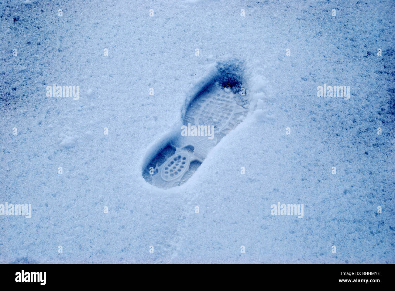 shot of right foot impression in snow Stock Photo - Alamy